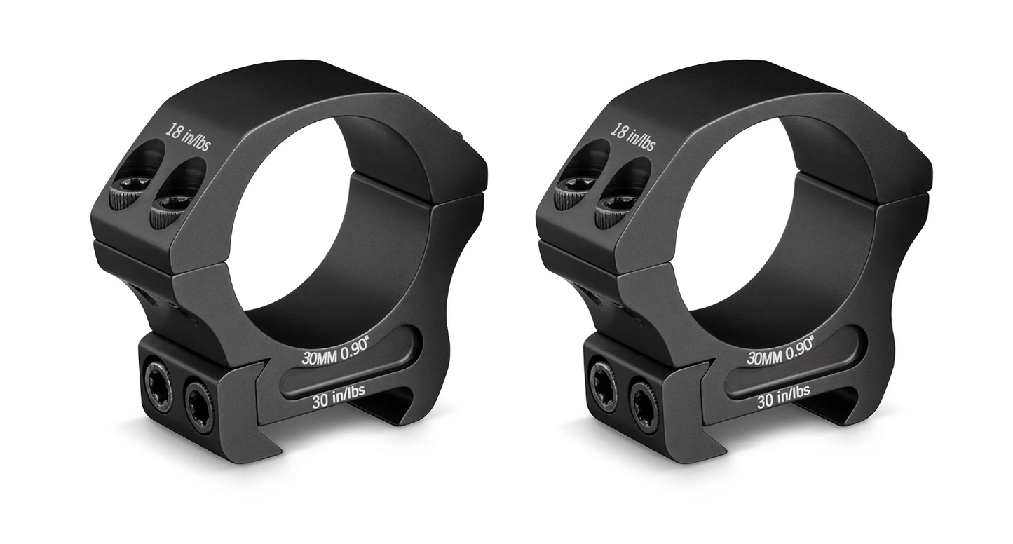 A pair of black riflescope rings with visible screw holes and branding on the side.